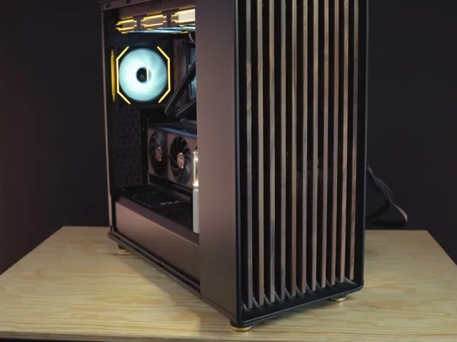 A wood-panelled PC case with a glass side and soft white fans