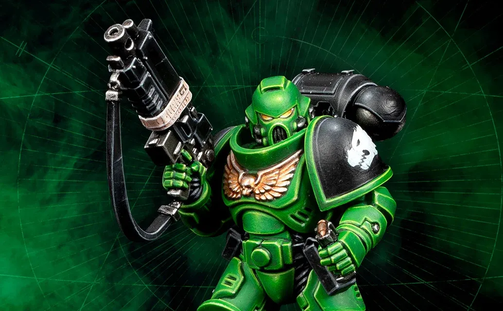A Space Marine miniature painted in bright green armour